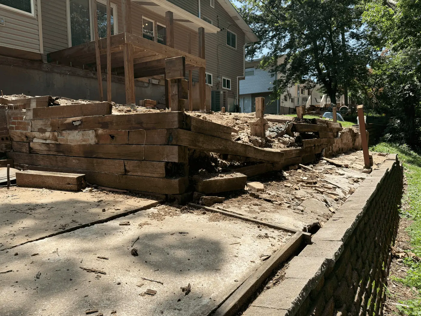 Aging railroad-tie retaining wall before replacement in Town & Country, Missouri