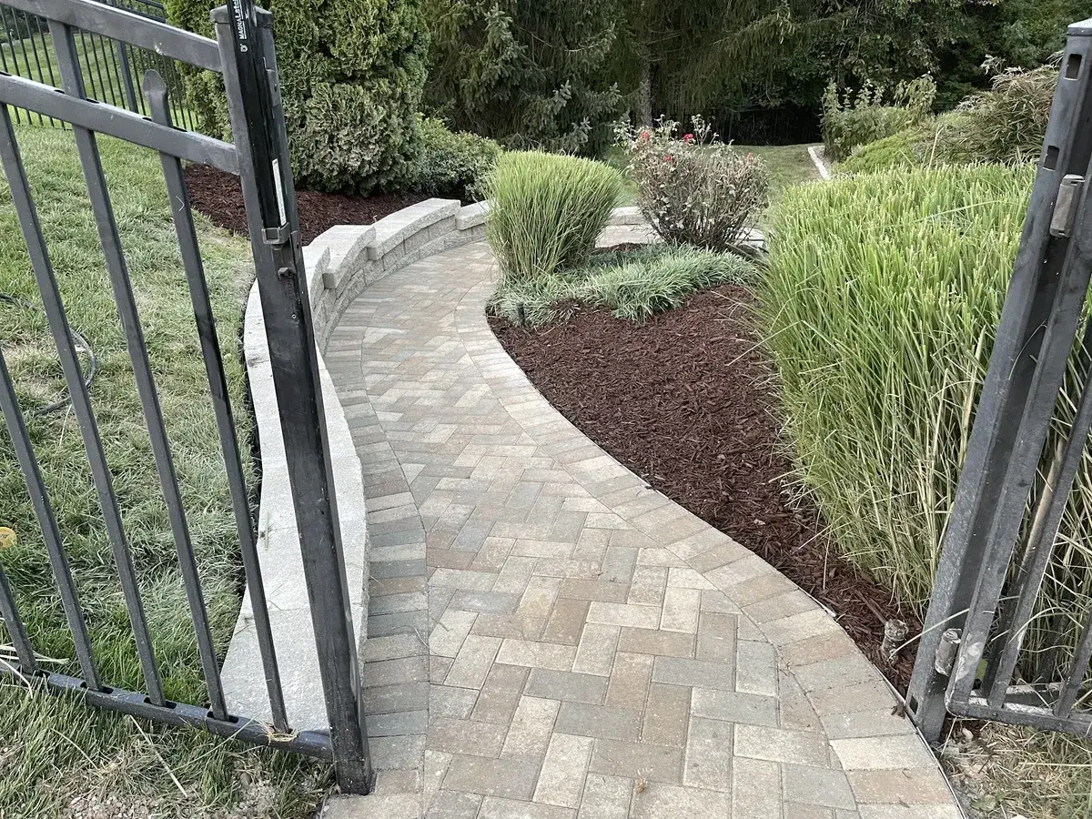 New paver walkway replacing old concrete sidewalk