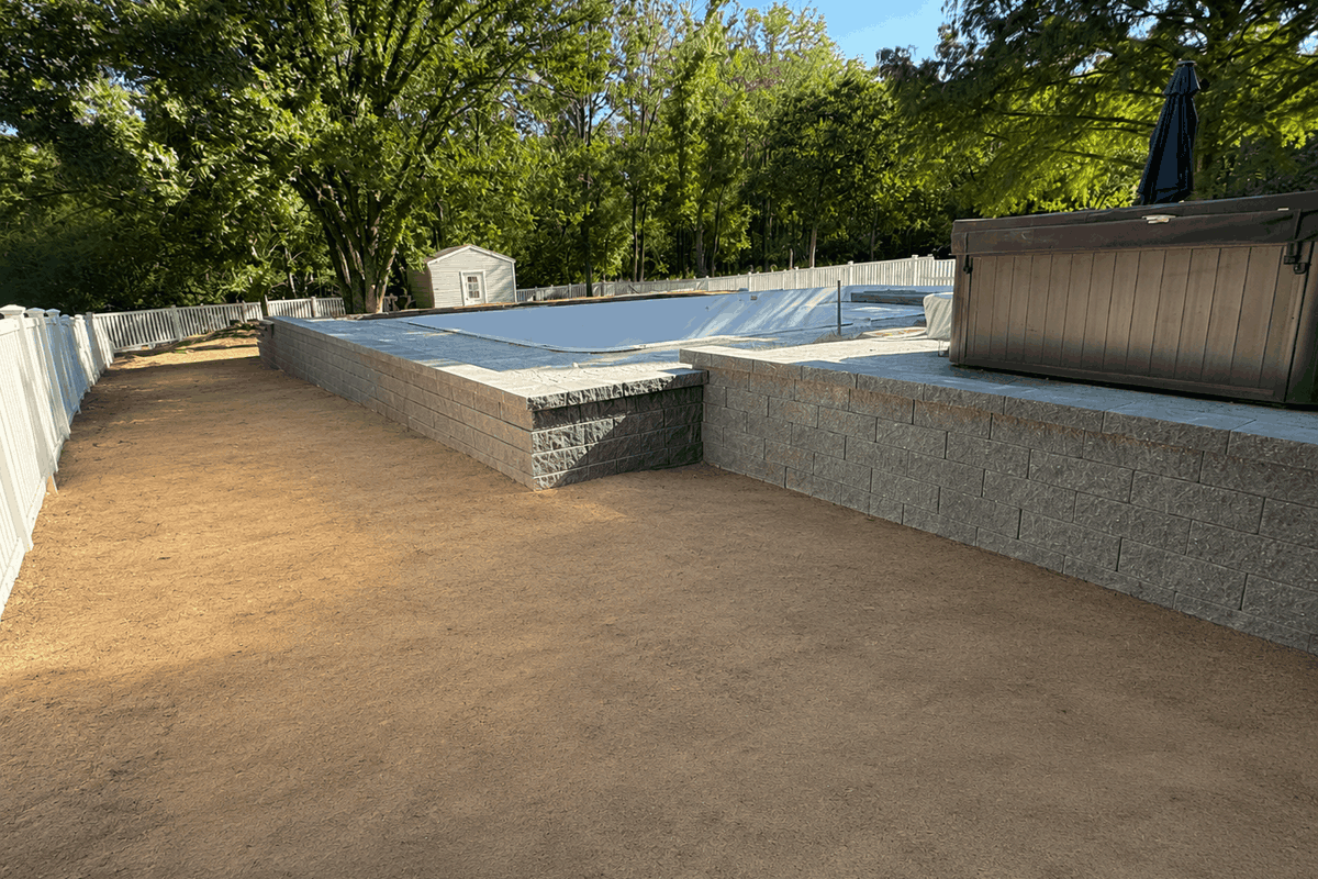opt Backyard pool with retaining wall project in Manchester Mo